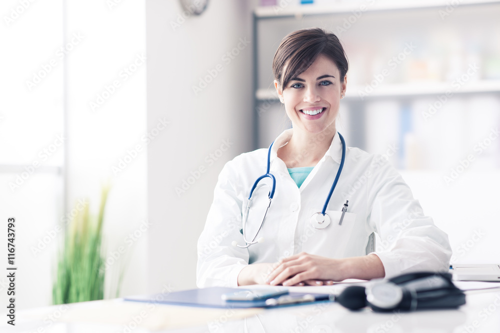 Doctor working at office desk