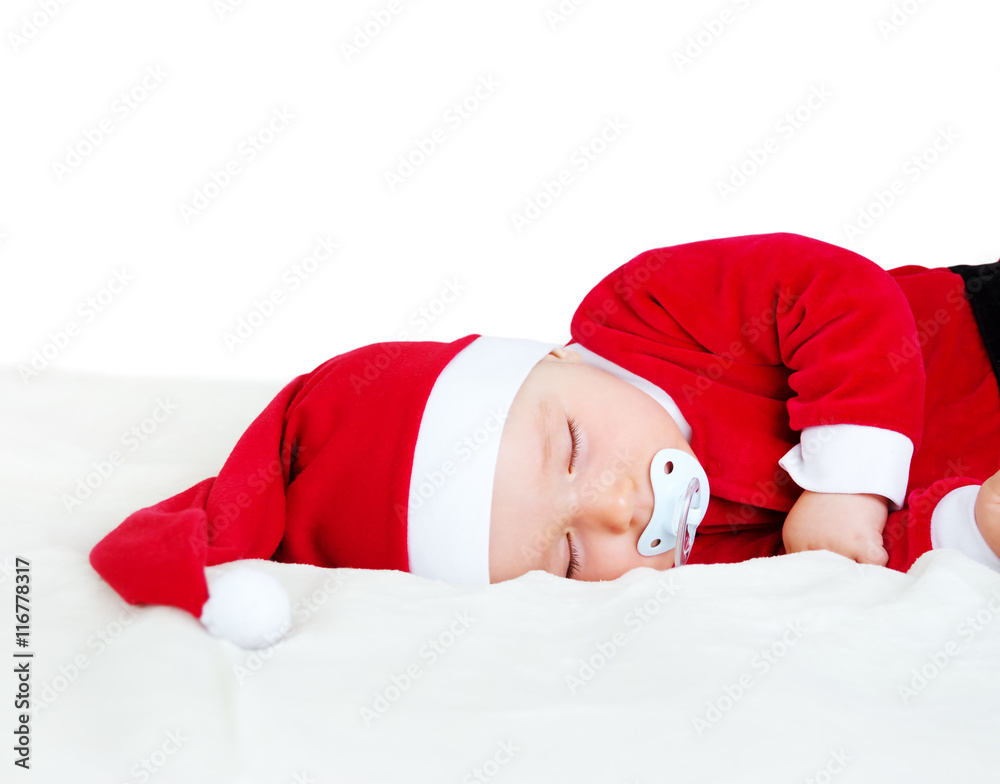 Baby sleeping in santa costume