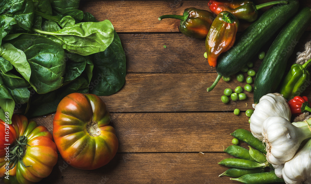 Fresh raw vegetable ingredients for healthy cooking or salad making on wooden background, top view, 