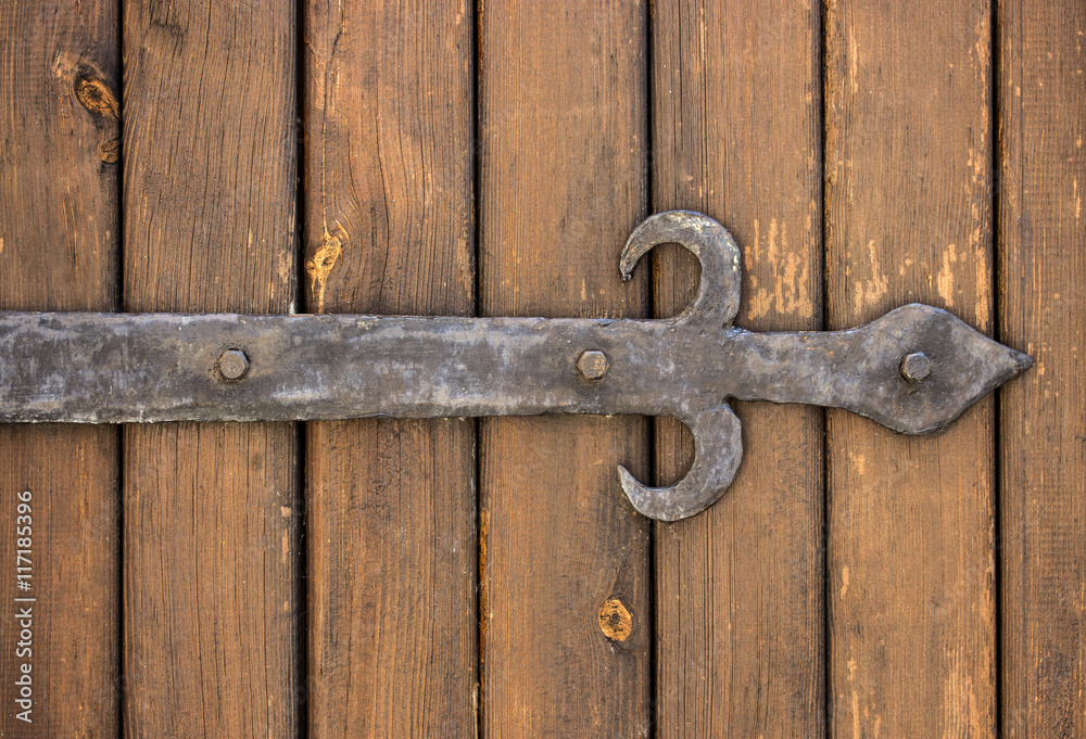 Dark wooden texture with forged metal elements