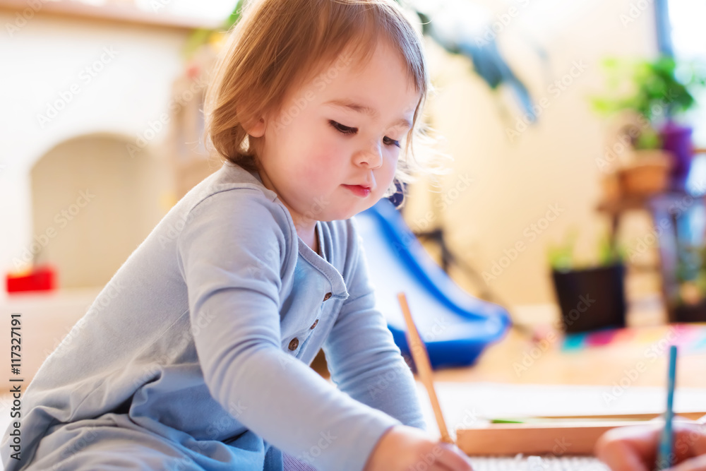 Toddler girl drawing picture