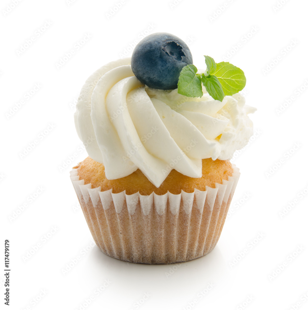 Cupcake with blueberries and mint flavoured cream isolated on white background.