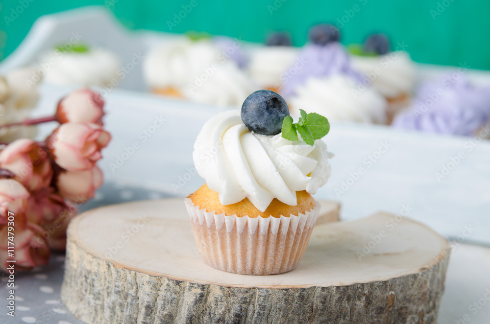 Summer cupcakes with blueberries and mint flavoured cream. Homemade.