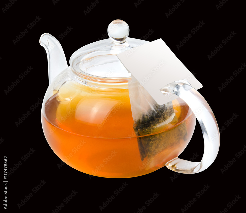 Teapot glass with tea bag isolated on a white background with clipping path. Front view.