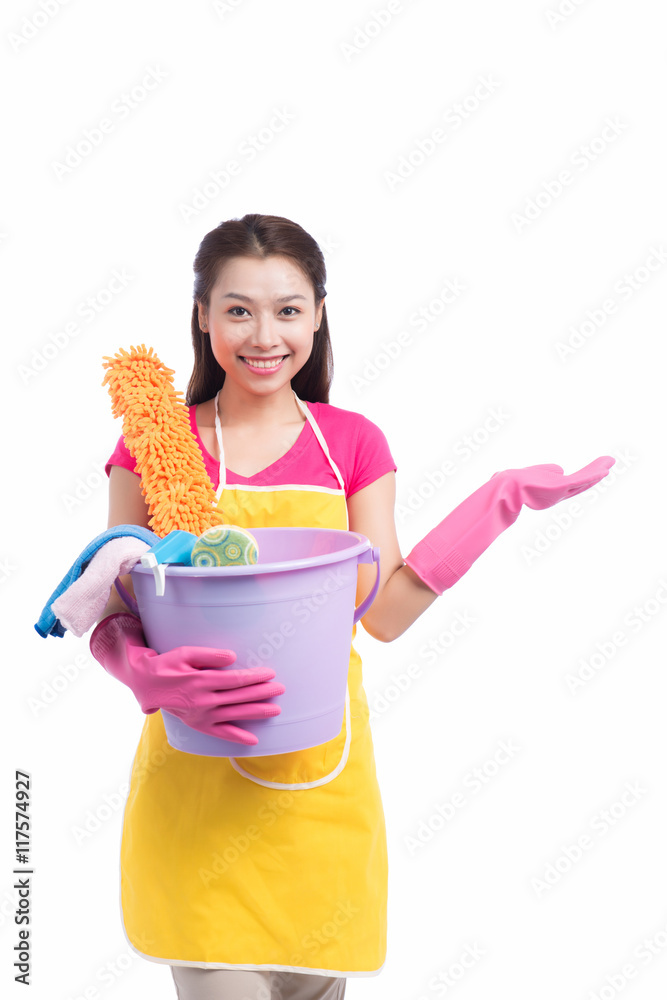 Young asian woman holding floor brush, bucket and rag, isolated