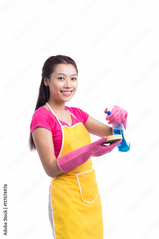 Portrait of a beautiful girl with a detergent for cleaning