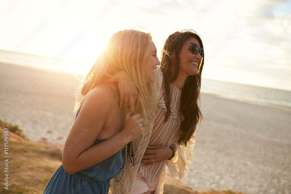 Female friends together on the sea shore