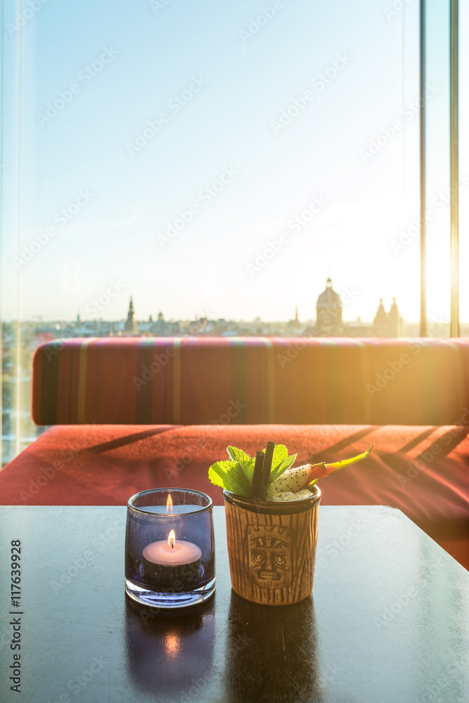 Tropical fruit dragon fruit cocktail on table in rooftop bar