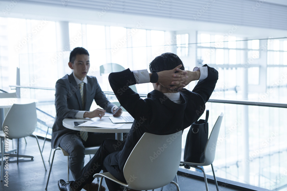 Young businessman has a bored meeting