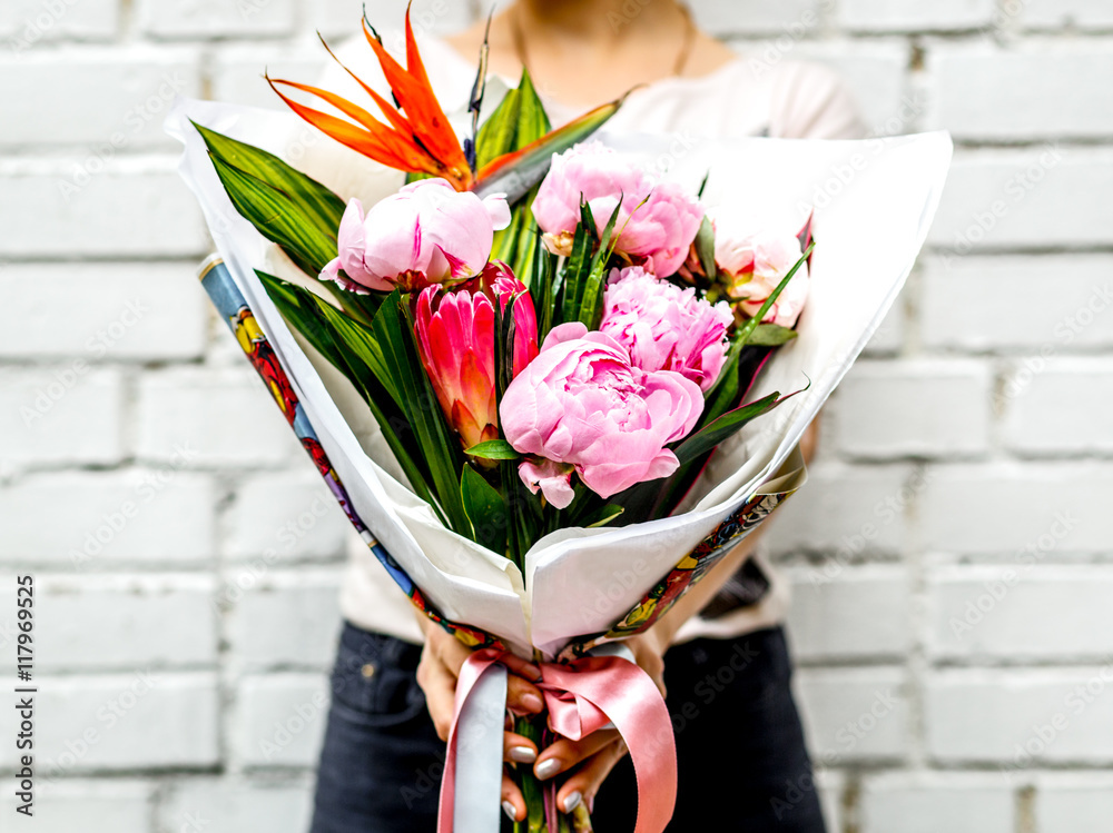 woman with bouquet of flowers in kraft paper