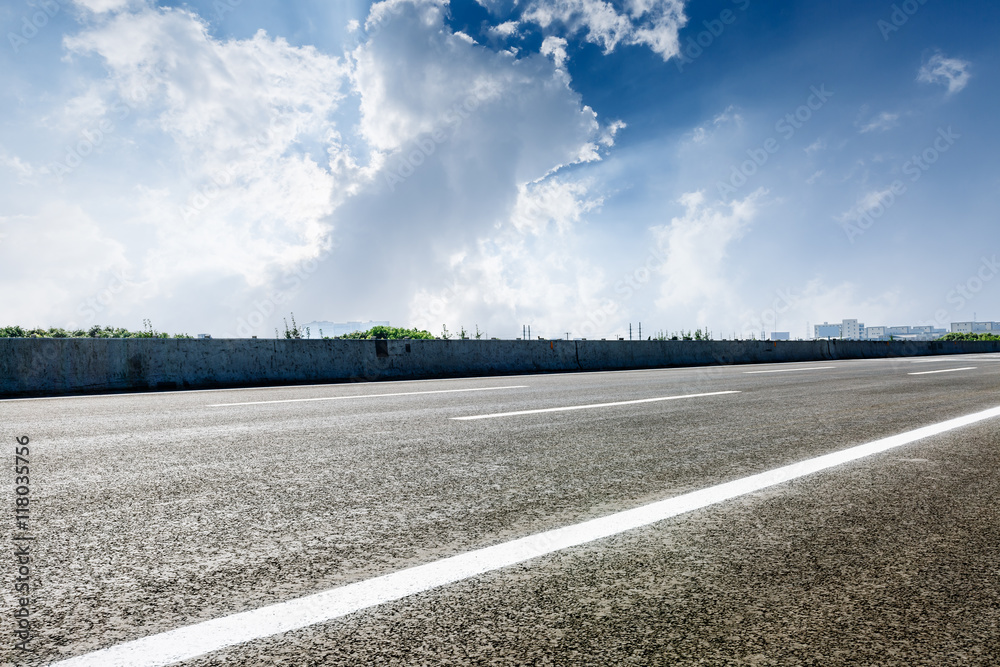 The new asphalt road under the blue sky