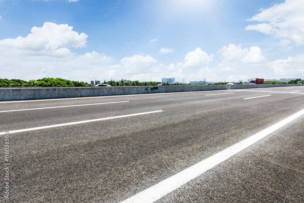 The new asphalt road under the blue sky