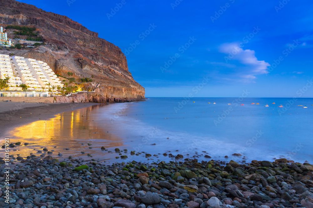 Atlantic beach of Gran Canaria island in Taurito at dusk, Spain