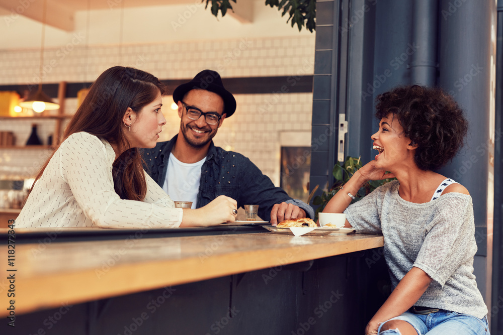 Group of friends talking in a cafe