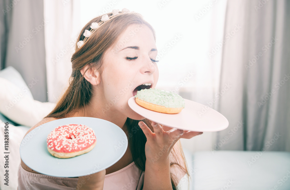 Woman look like princess at home with two donuts