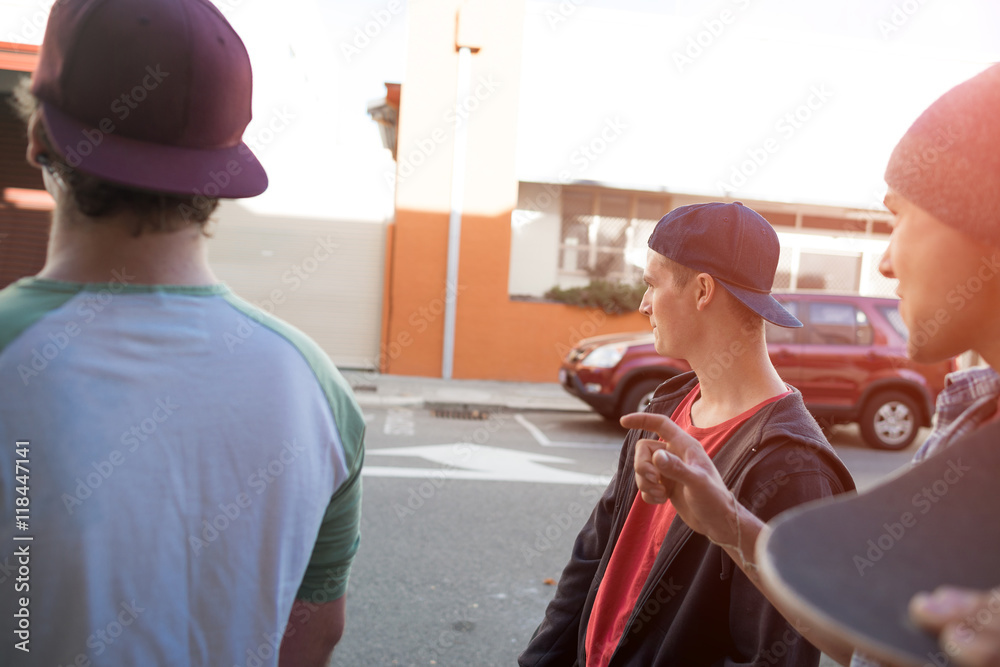 Guys skateboarders in street