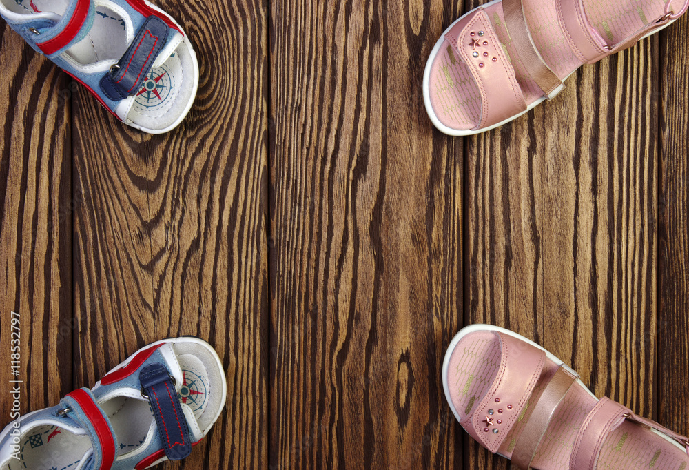 Childs sandals on a wood