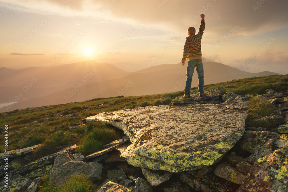 Winner silhouette on the mountain top. Sport and active life concept..