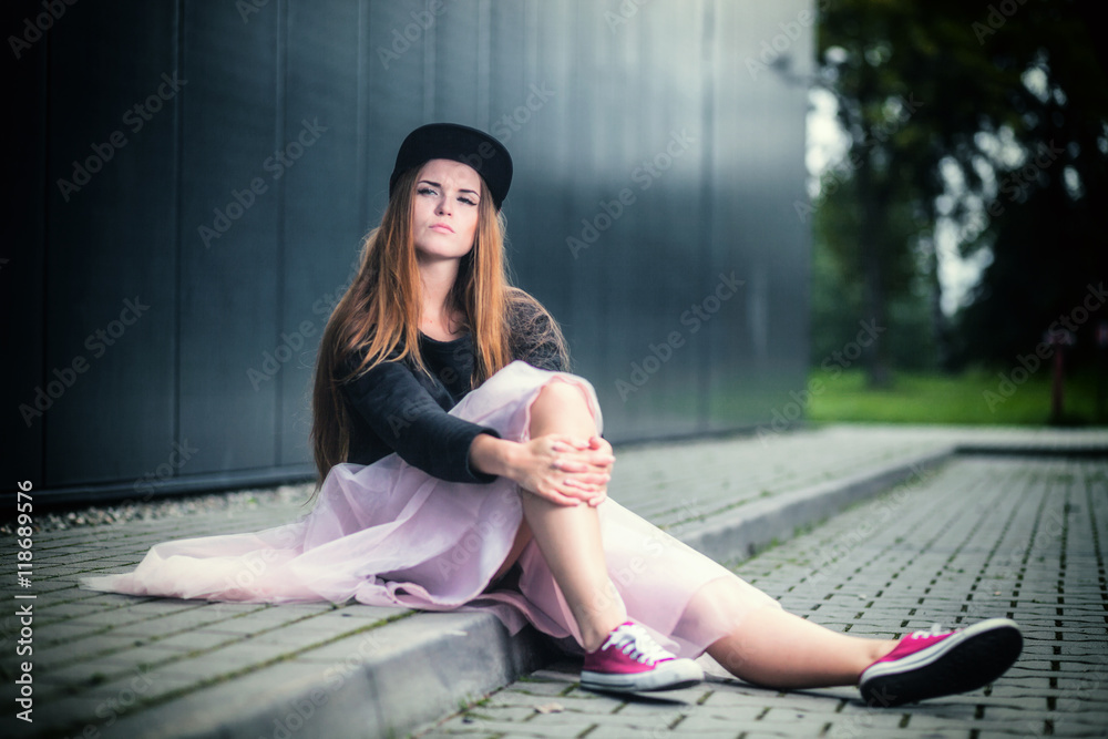 Trendy beautiful long haired girl posing, hip hop fashion