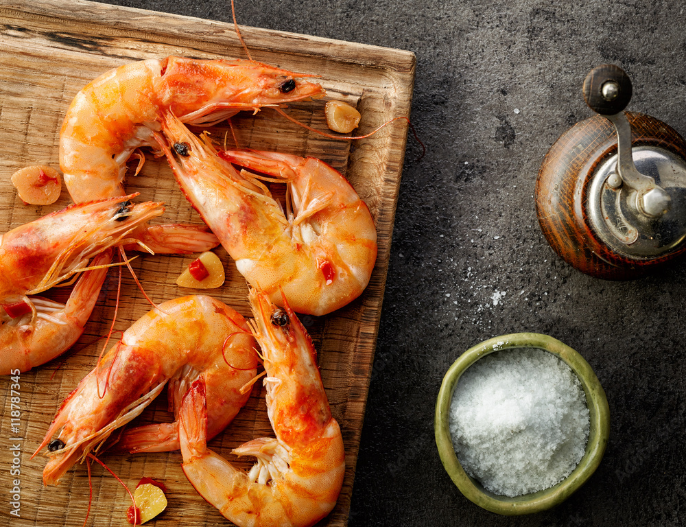 roasted prawns on wooden cutting board