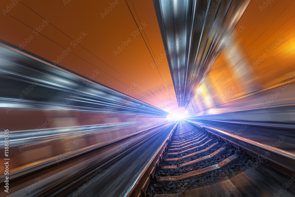 Railway station at night with motion blur effect. Railroad