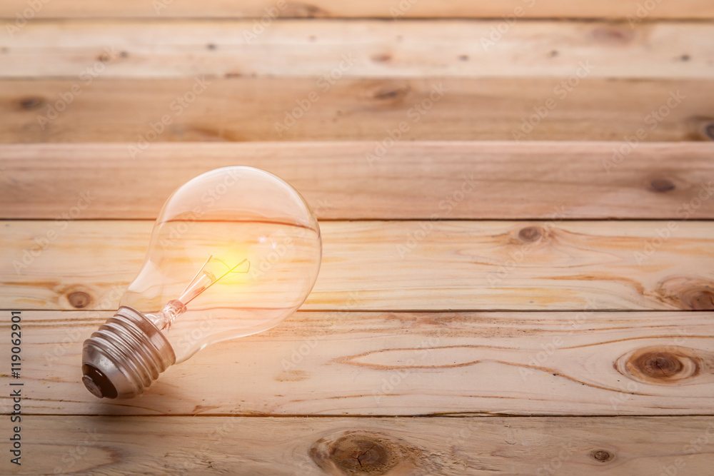 light bulb with brown wooden floor