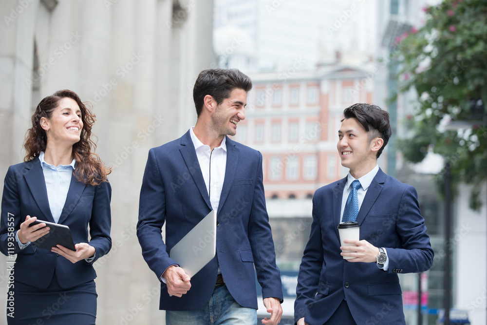 business people walk on road