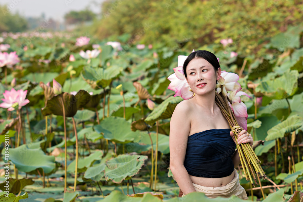 Beautiful girl with a lotus flowers