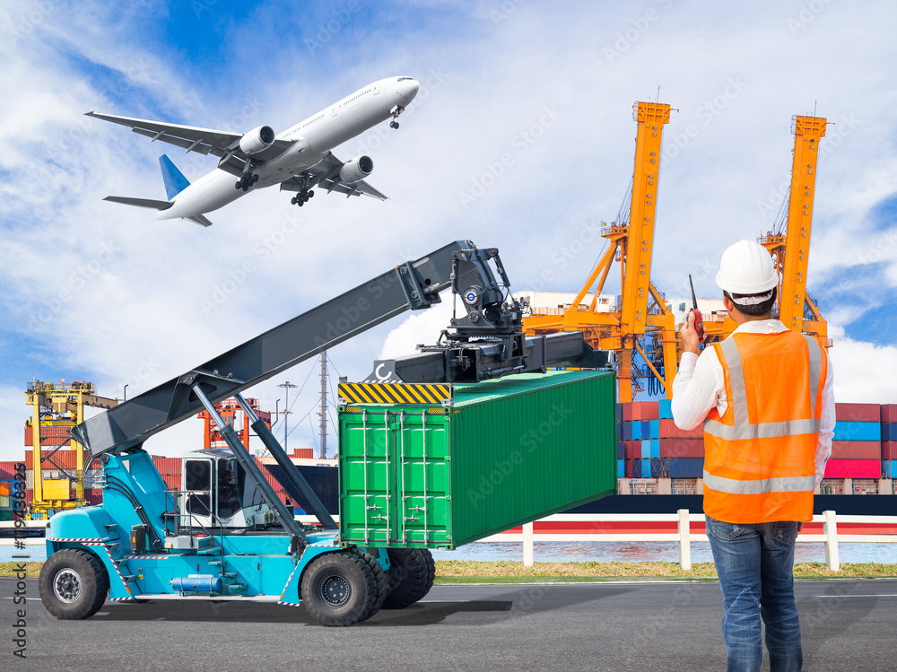 Dock worker talking with radio for controlling loading container