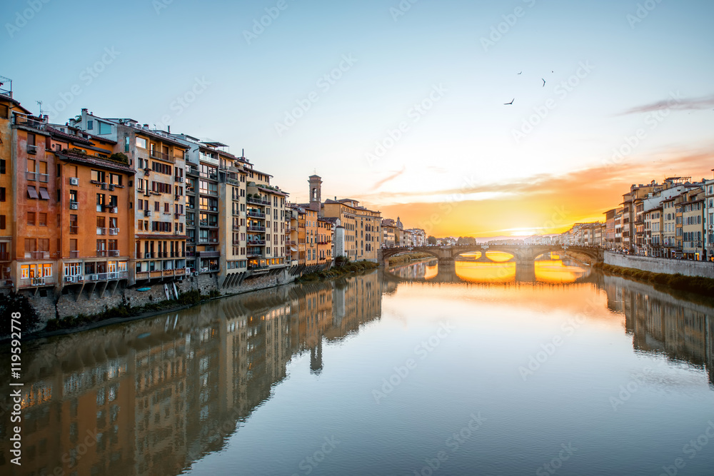 Cityscape view on Arno river with famous Holy Trinity bridge on the sunset in Florence