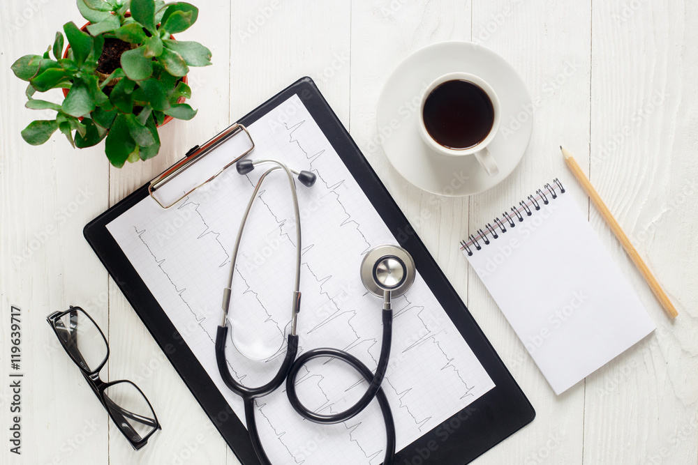 doctor workplace with a stethoscope top view girl hands