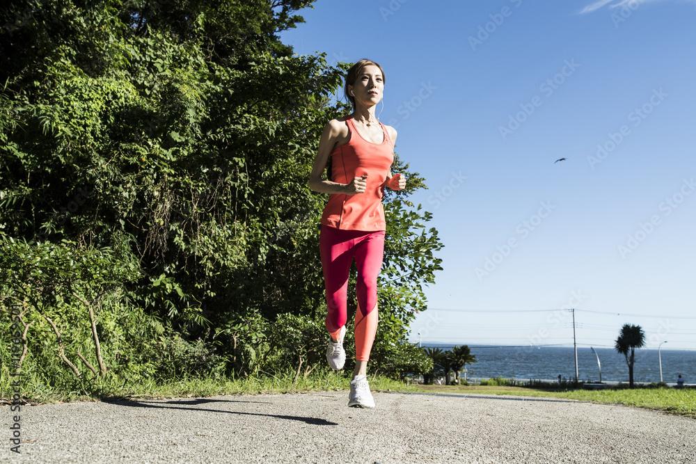 Slender woman running in the park