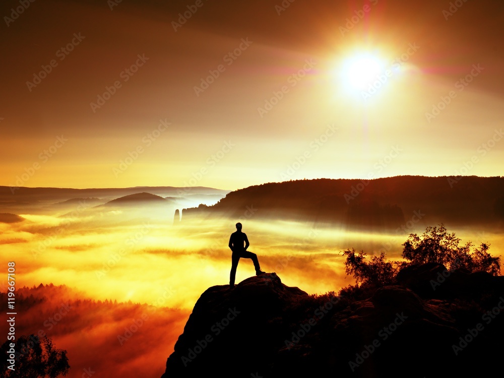 Man silhouette on the sharp peak. Satisfy hiker enjoy view.