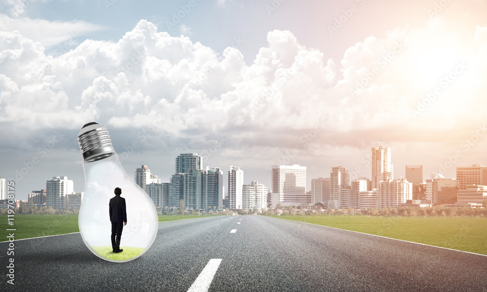 Businessman inside light bulb