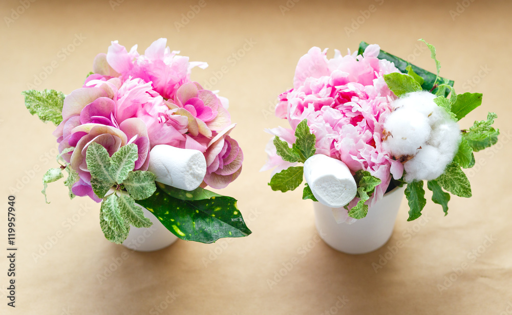 bouquets of peonies in a small vase