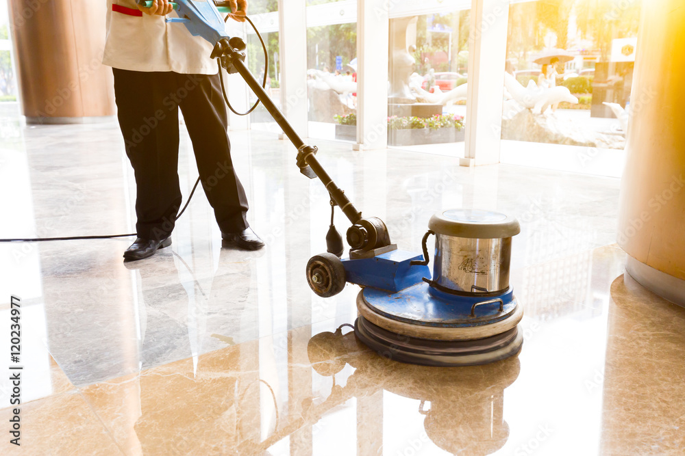 people polishes floor indoors