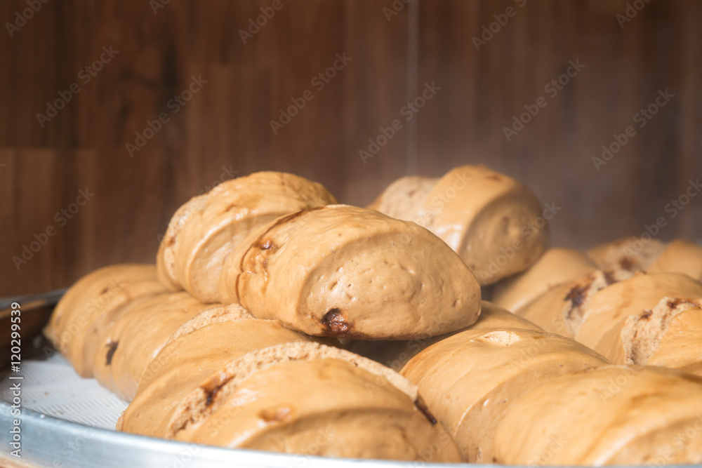 Chinese steamed bun or Mantou in bamboo basket in market