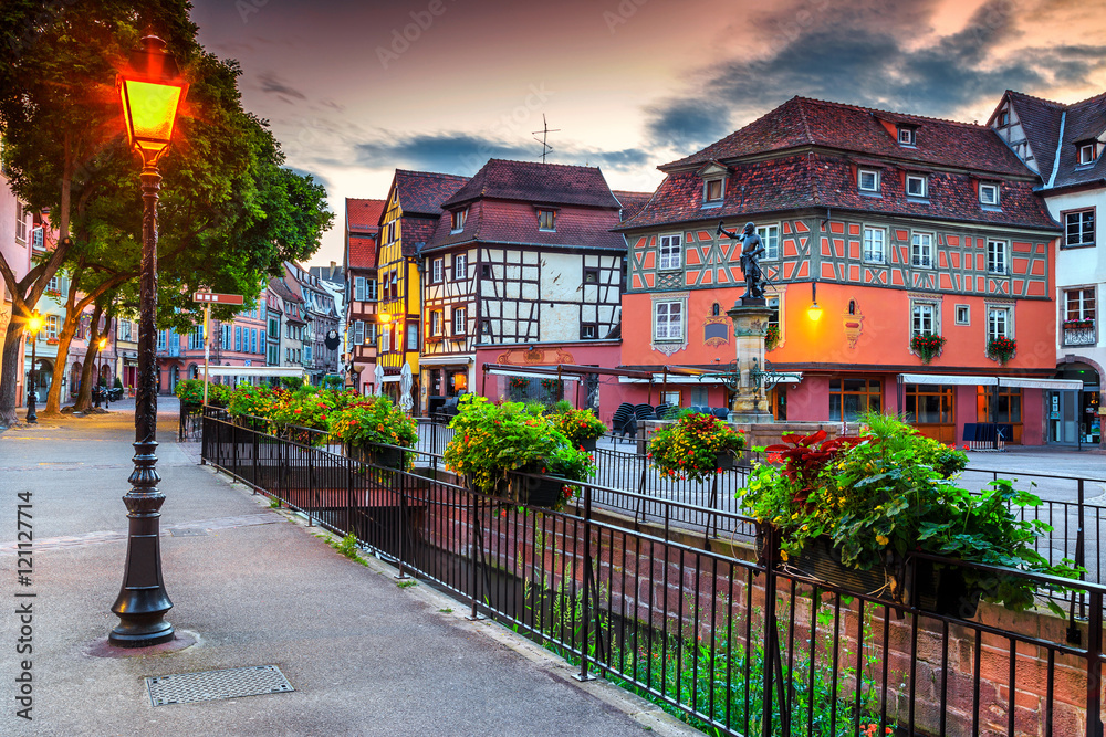 Colorful medieval half-timbered facades with decorated street,Colmar,France