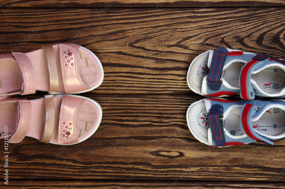 Childs sandals on a wood