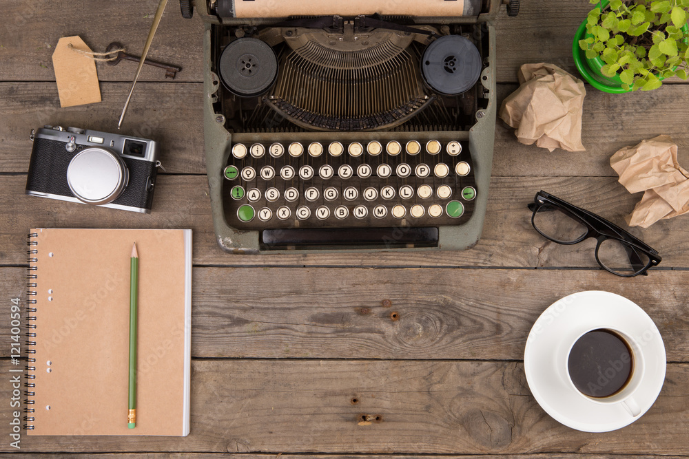 Vintage typewriter on the old wooden desk