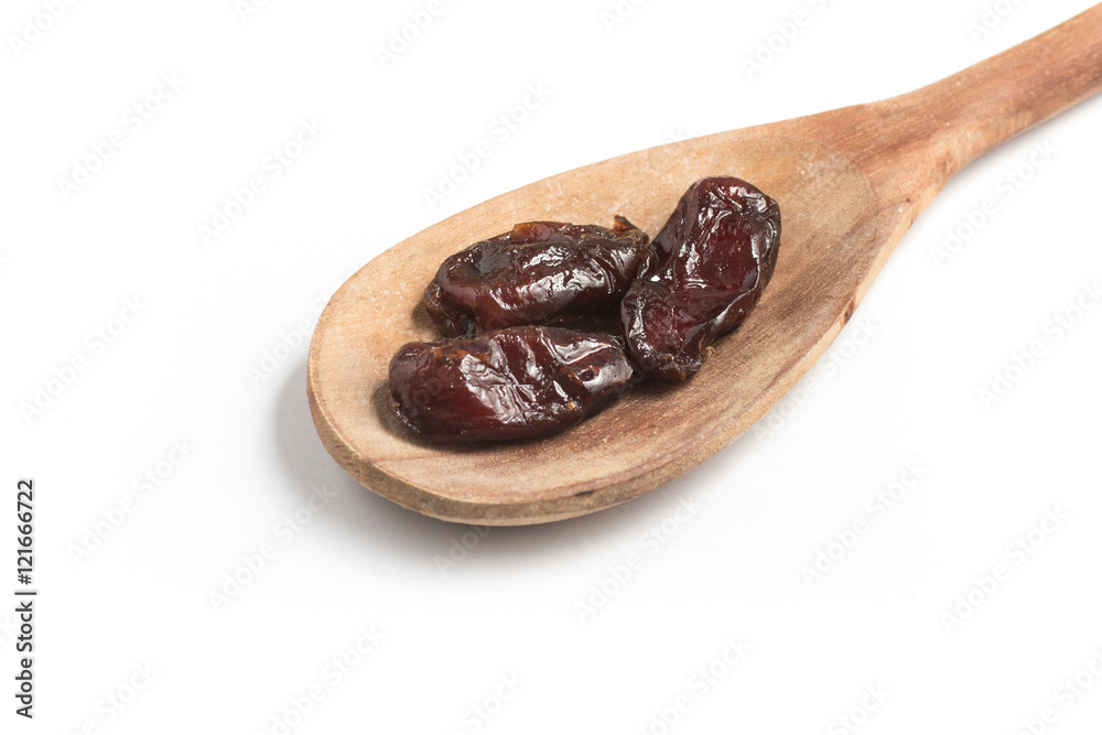 Dried Dates into a spoon. Tamara