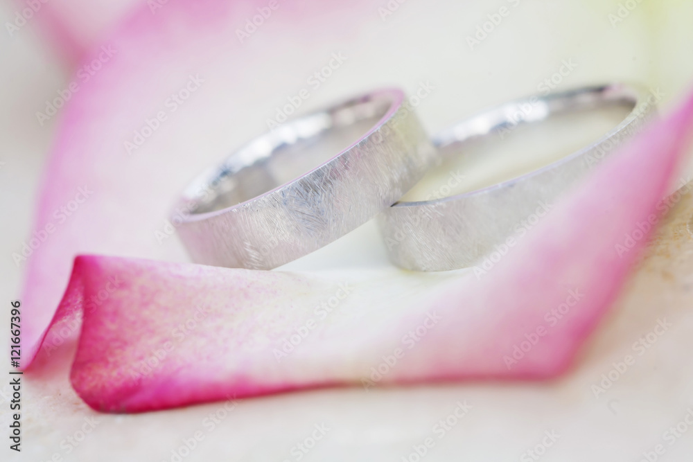 Wedding rings with beautiful rose blossom company