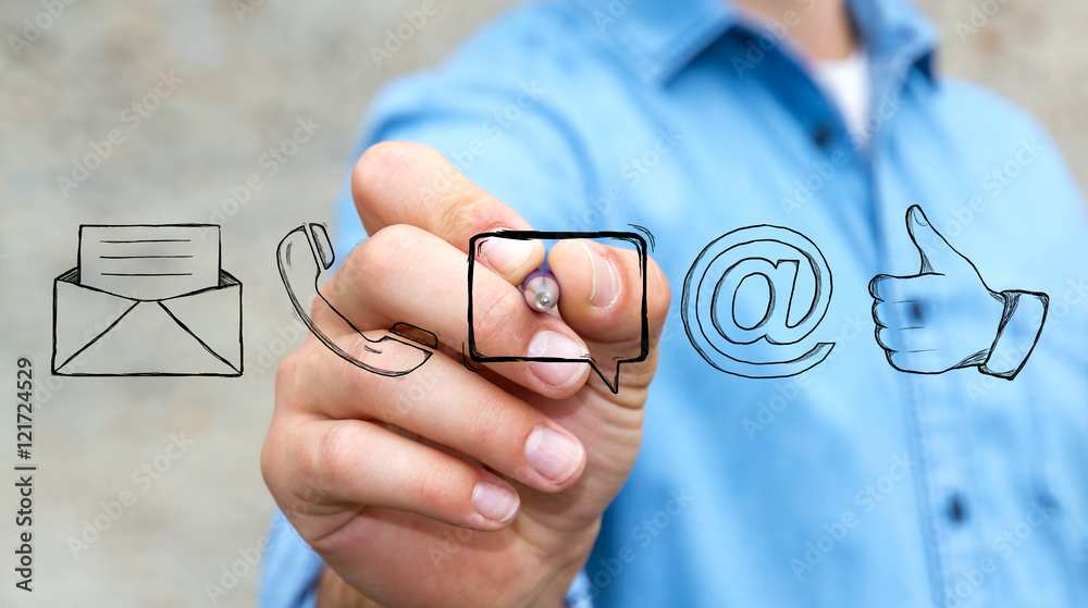 Businessman drawing manuscript contact icon with a pen