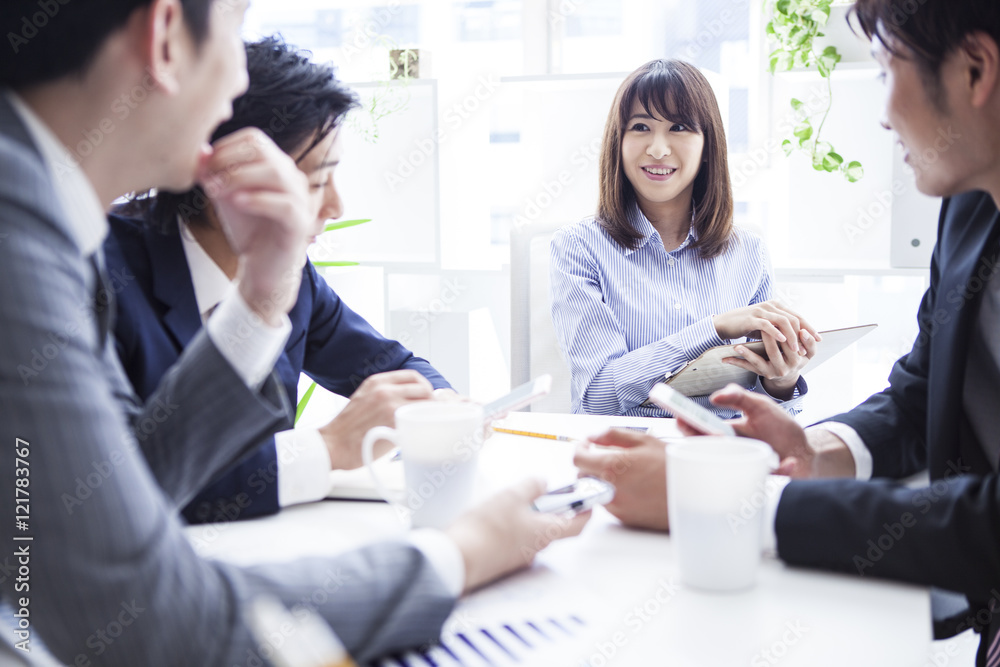 Four businessmen working in bright office