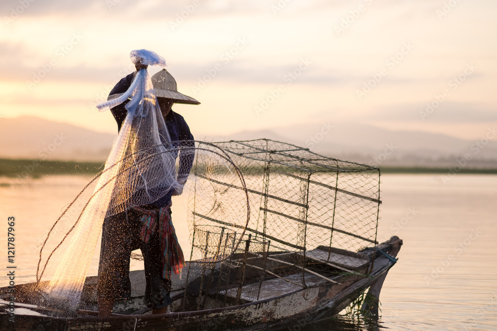 Fisherman fishing in morning