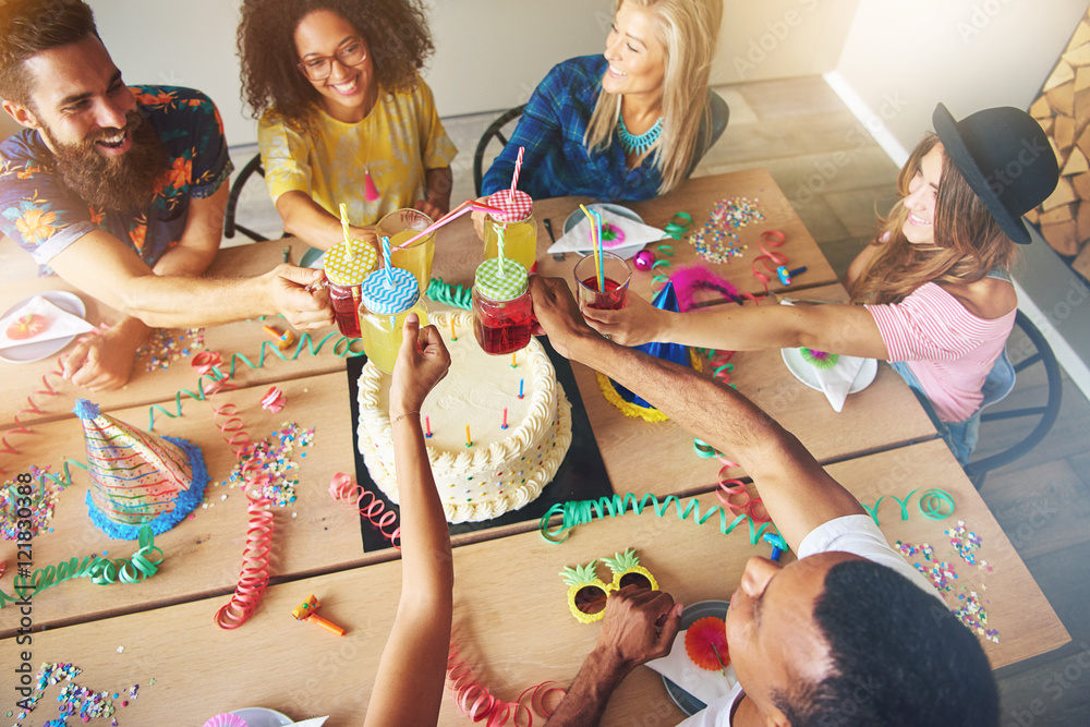 View from above on group around birthday cake