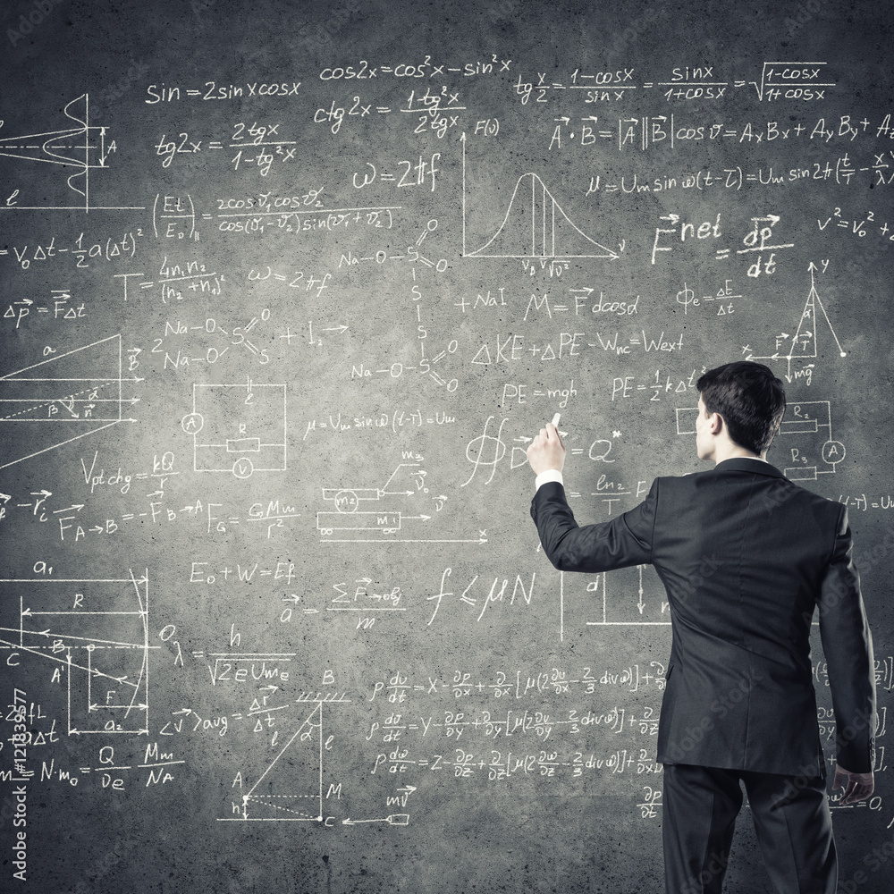 Man writing on blackboard