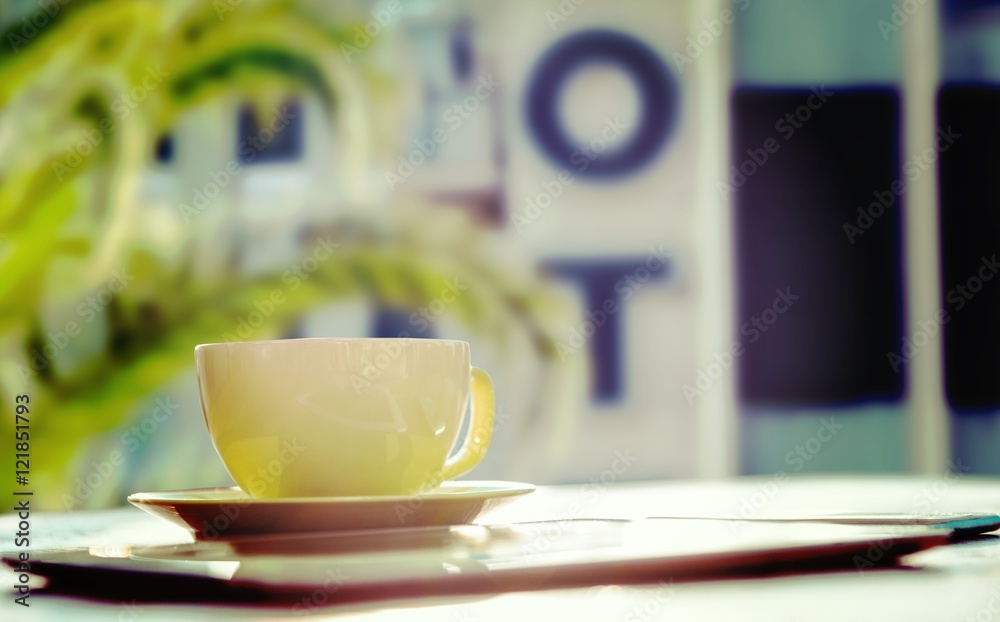 Composite image of cup of coffee and tablet pc