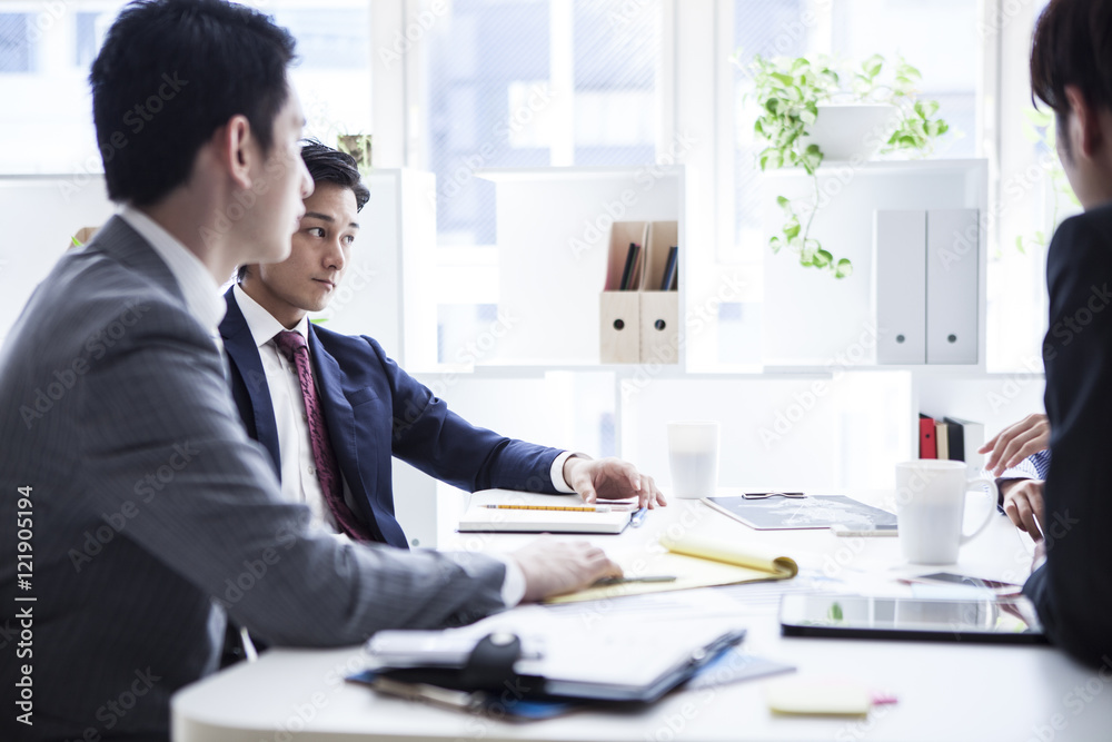 Young businessman who has been a discussion in a bright office