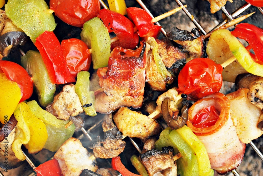 Stock image of close up of grilled beef and chicken kebabs